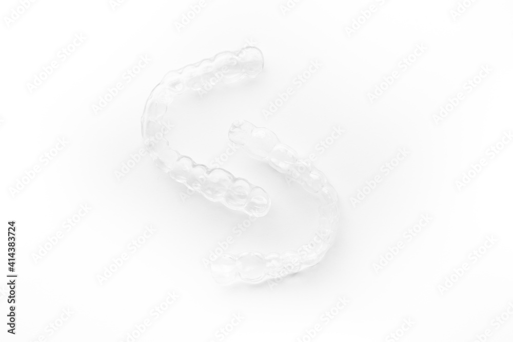 Invisible transparent aligners plastic braces dentistry retainers on white