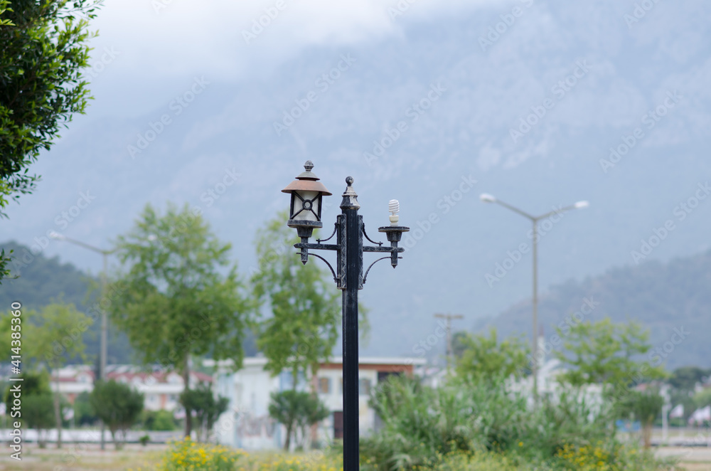 A large beautiful lantern on the background of a mountain landscape