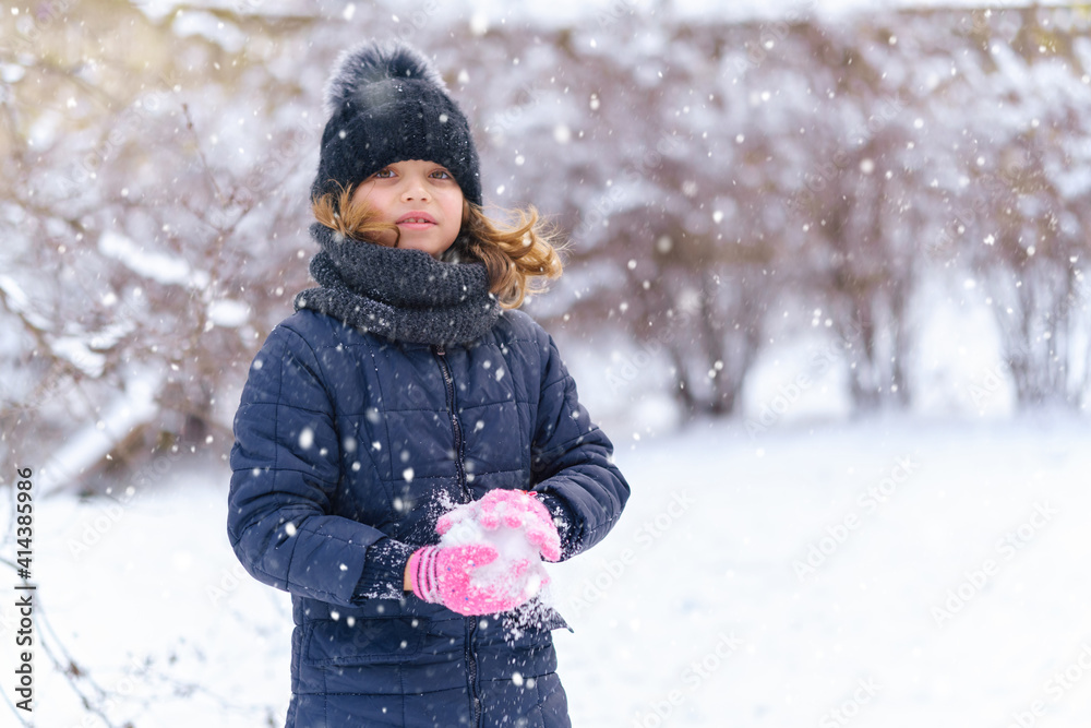 child girl playing with snow in winter outdoor and having fun on snowy winter child girl playing with snow in winter outdoor and having fun on snowy winter