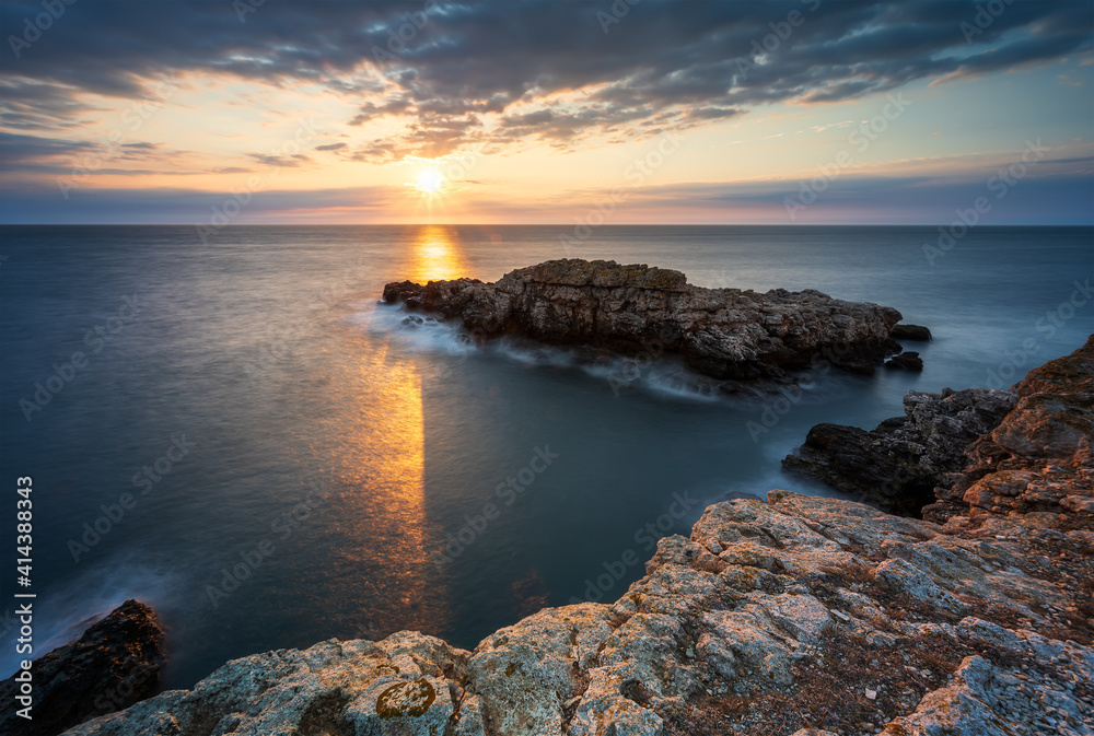 Amazing view with colorful sunrise sky at the rocky coastline of the Black Sea