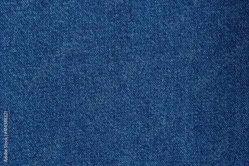 Denim blue jeans fabric. Denim background texture for design. Canvas denim. Blue jeans texture for any background.