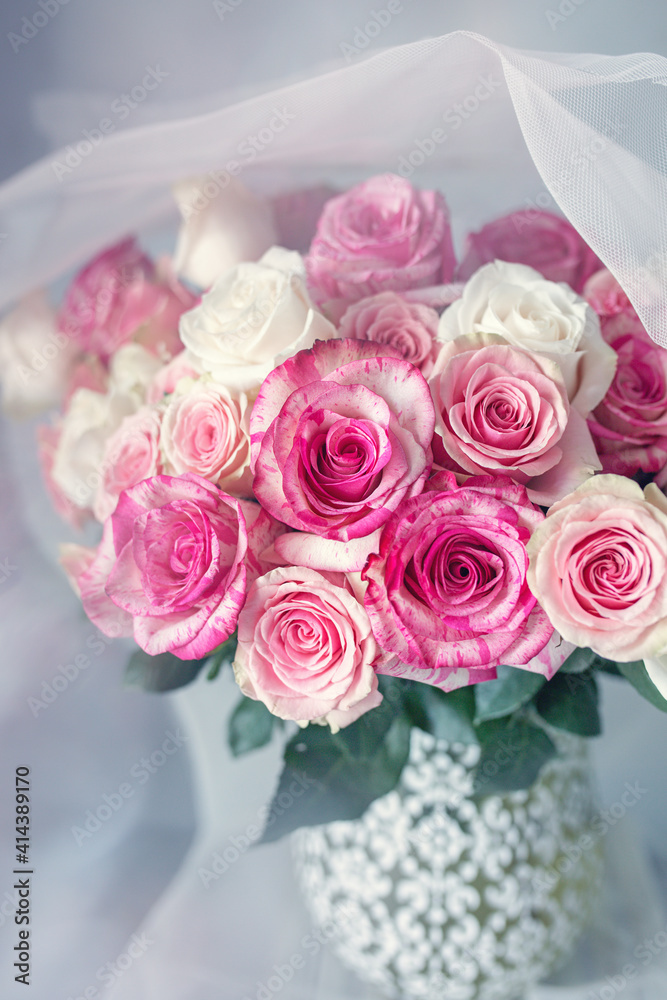 Bright bouquet of a beautiful tea roses in a ceramic jug.Soft focus Bright bouquet of a beautiful tea roses in a ceramic jug.Soft focus