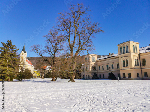 Empire Chateau with Museum of painter Josef Manes. Park and Castle Cechy pod Kosirem, Moravia, Czech during winter, covered with snow. © Padisczek