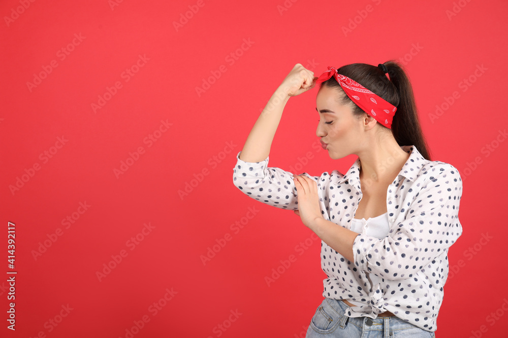Strong woman as symbol of girl power on red background, space for text. 8 March concept Strong woman as symbol of girl power on red background, space for text. 8 March concept
