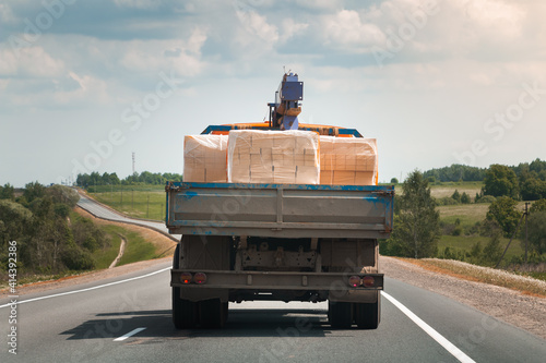 The truck is transporting bricks photo