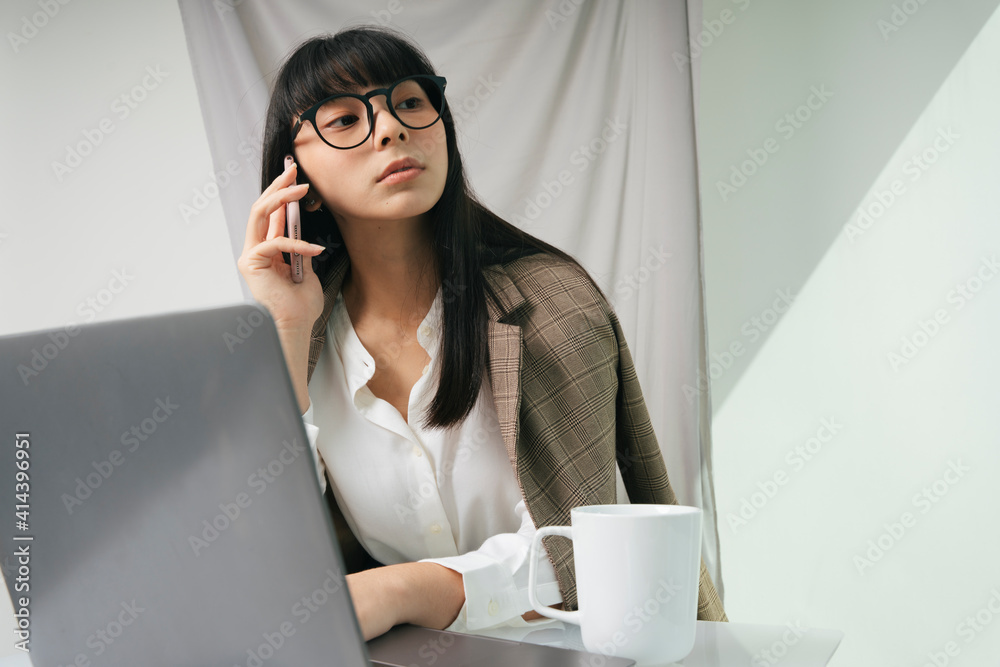 Business asian thai long dark hair woman wearing eyeglasses using laptop.