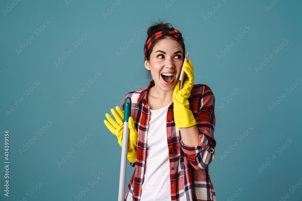 Excited attractive woman in rubber gloves and apron Excited attractive woman in rubber gloves and apron
