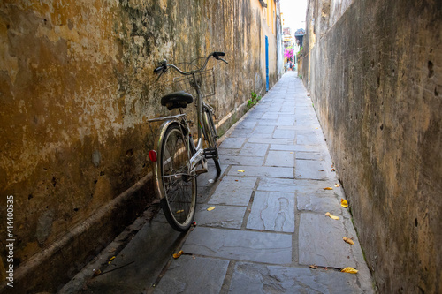 Rustic bicycle on narrow street, asian cityscape. Traditional personal transport in Asia. Vietnam city culture.