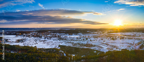 Aerial view of the sunset over the winter forest in Poland