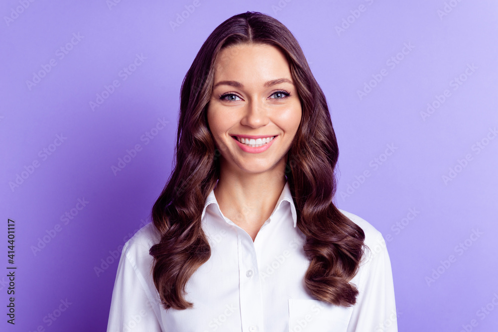 Photo of positive charming businesswoman toothy beaming smile wear white shirt isolated purple color background Photo of positive charming businesswoman toothy beaming smile wear white shirt isolated purple color background