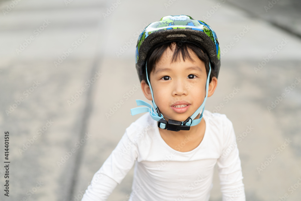 boy is riding bicycle at the park.