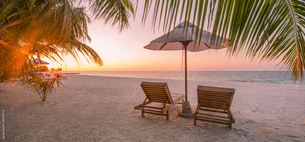 Obraz premium Beautiful beach. Chairs on the sandy beach near the sea. Summer holiday and vacation concept for tourism. Inspirational tropical landscape. Tranquil scenery, relaxing beach, tropical landscape design