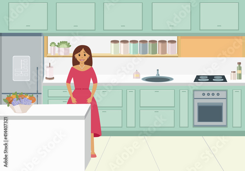 Young woman in dress in her kitchen