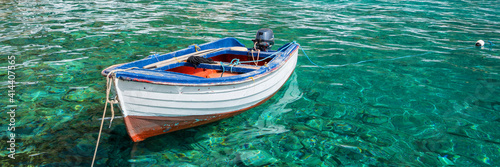 Ffishing boat on panoramic clear pristine water in Crete, Greece