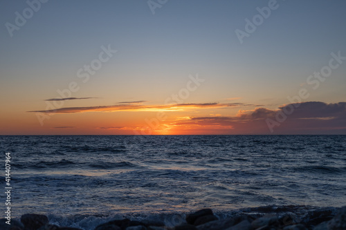 landscape - sunset on the coast, waves, horizon. top view.