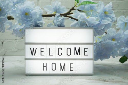 Welcome Home Word in light box with flowers decoration