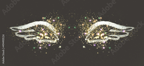 Golden glitter on abstract silver hand painted wings on black background