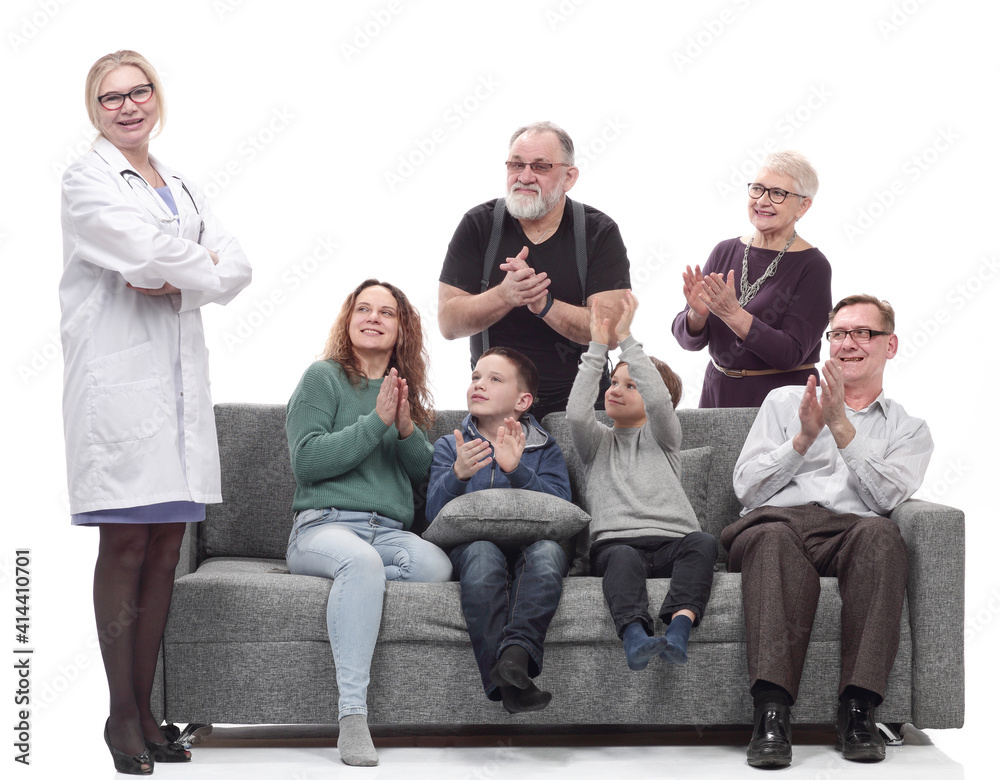 portrait of a large family with their family doctor. portrait of a large family with their family doctor.
