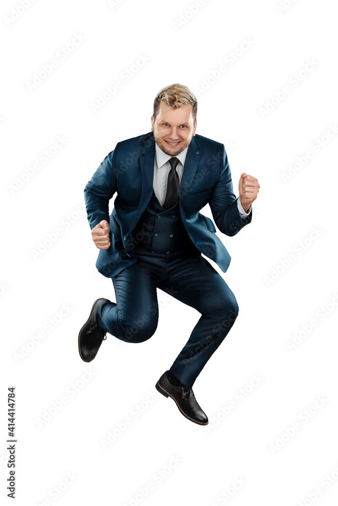 A man in a business suit, a joyful businessman jumped up. Isolated on a white background. A man in a business suit, a joyful businessman jumped up. Isolated on a white background.