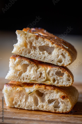 A beautiful traditional focaccia cut into pieces. Focaccia of natural sourdough