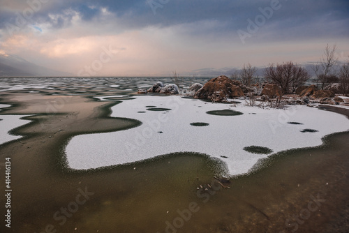 frozen rocks on the shores of the lake