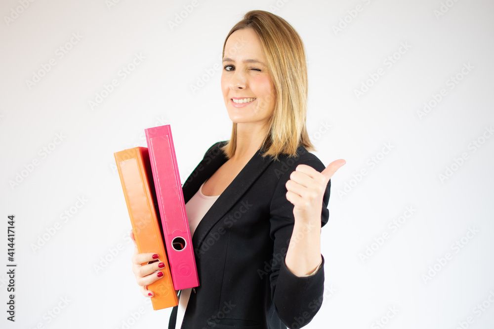 Young business woman holding file cabinets over white background. Young business woman holding file cabinets over white background.