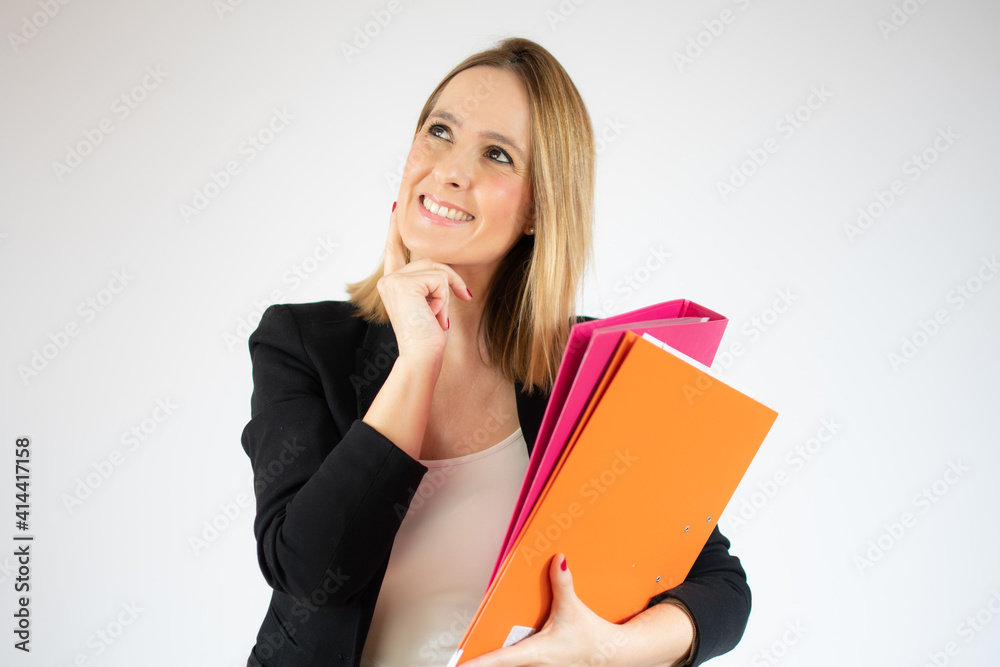 Portrait of young office woman smiling looking aside and holding finger at cheek isolated over white background Portrait of young office woman smiling looking aside and holding finger at cheek isolated over white background