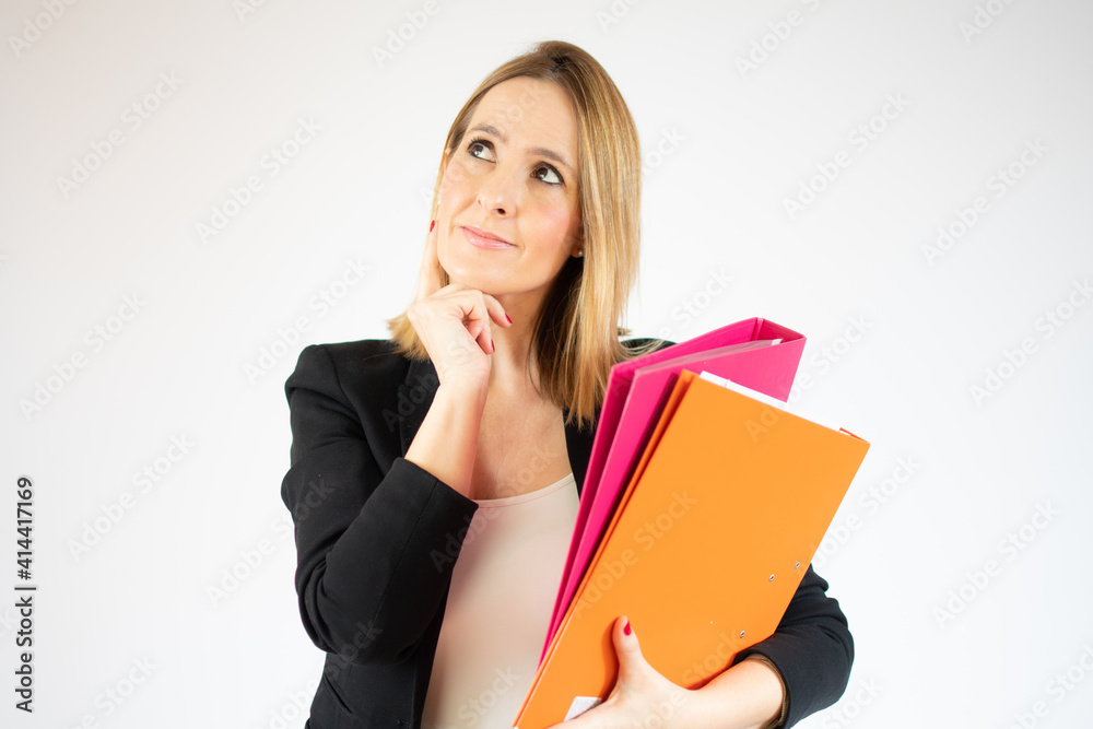 Portrait of young office woman smiling looking aside and holding finger at cheek isolated over white background Portrait of young office woman smiling looking aside and holding finger at cheek isolated over white background