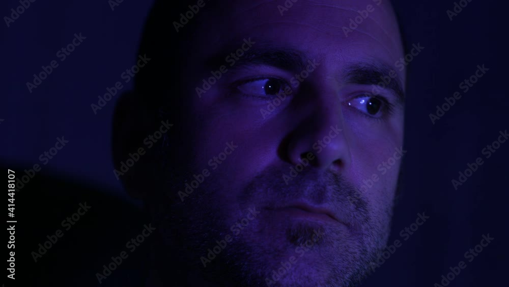 Young caucasian man is playing computer games late night Young caucasian man is playing computer games late night