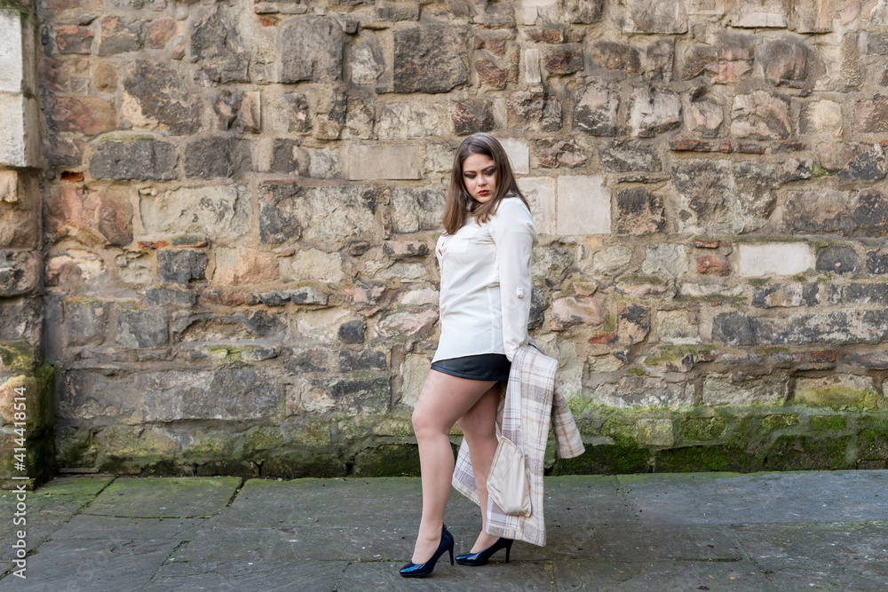 Very pretty woman overweight and dressed in light coat Very pretty woman overweight and dressed in light coat