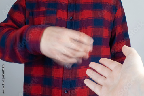 A patient with Parkinson's disease has trembling hands. Tremor of the extremities in various diseases. Close-up of a shivering man. Various objects tremble in hands. Neurological diseases