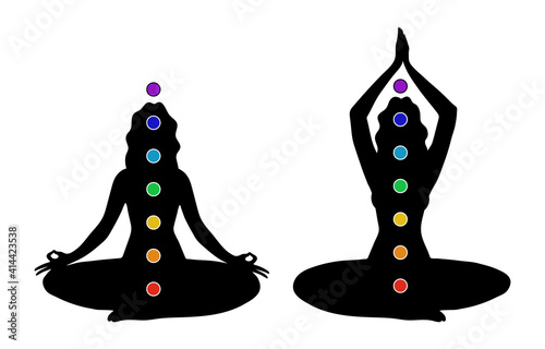 Female black silhouette with seven colored chakras. A woman practices yoga in the lotus position with the designation of the chakras in the body. Vector illustration isolated on white background
