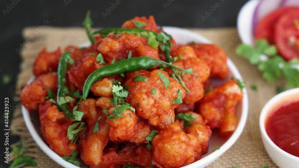 Gobi Manchurian dry, Gobi 65 popular Indian street food snack Delhi Mumbai India made cauliflower florets Veg Manchurian chilly gobi 4K slow motion footage video Indo Chinese side dish chapati roti Gobi Manchurian dry, Gobi 65 popular Indian street food snack Delhi Mumbai India made cauliflower florets Veg Manchurian chilly gobi 4K slow motion footage video Indo Chinese side dish chapati roti
