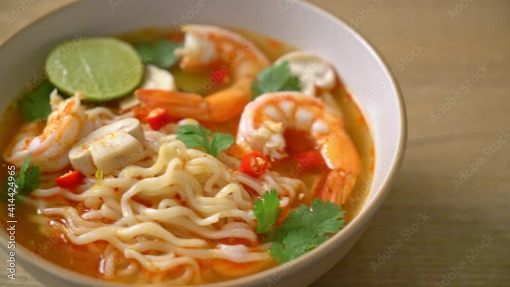 instant noodles ramen in spicy soup with shrimps (Tom Yum Kung) - Asian food style instant noodles ramen in spicy soup with shrimps (Tom Yum Kung) - Asian food style