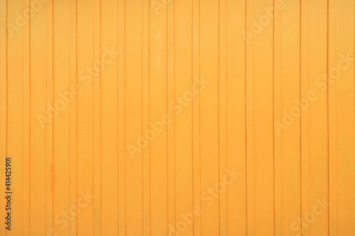 Wood planks texture background with yellow painted color.