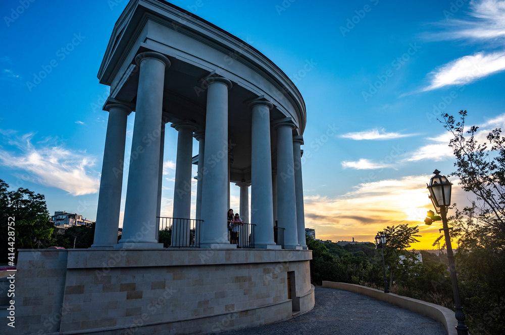 historical landmark colonnade arch with evening sky and sunset 