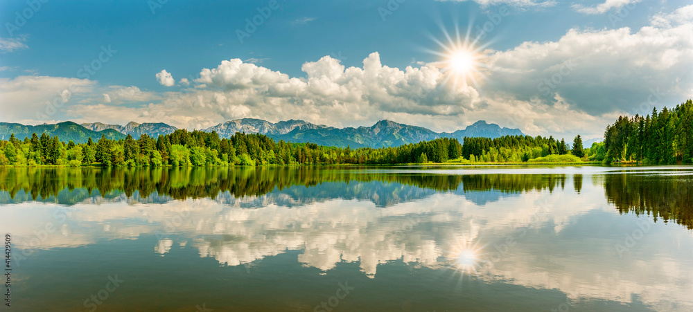 panoramic landscape with mountain range in Bavaria at springtime panoramic landscape with mountain range in Bavaria at springtime