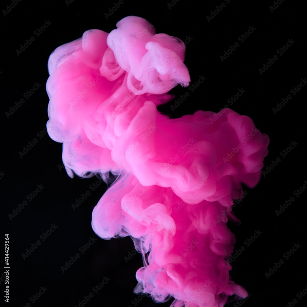 Fluid art. Abstract background. Pink flow on black.