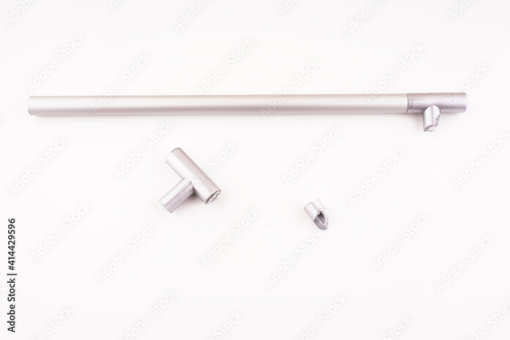 broken plastic handle from cabinet on white background broken plastic handle from cabinet on white background