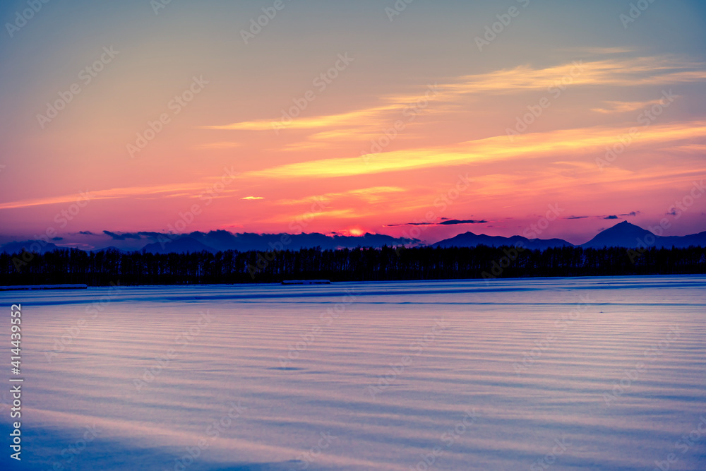 Obraz premium sunset over the river