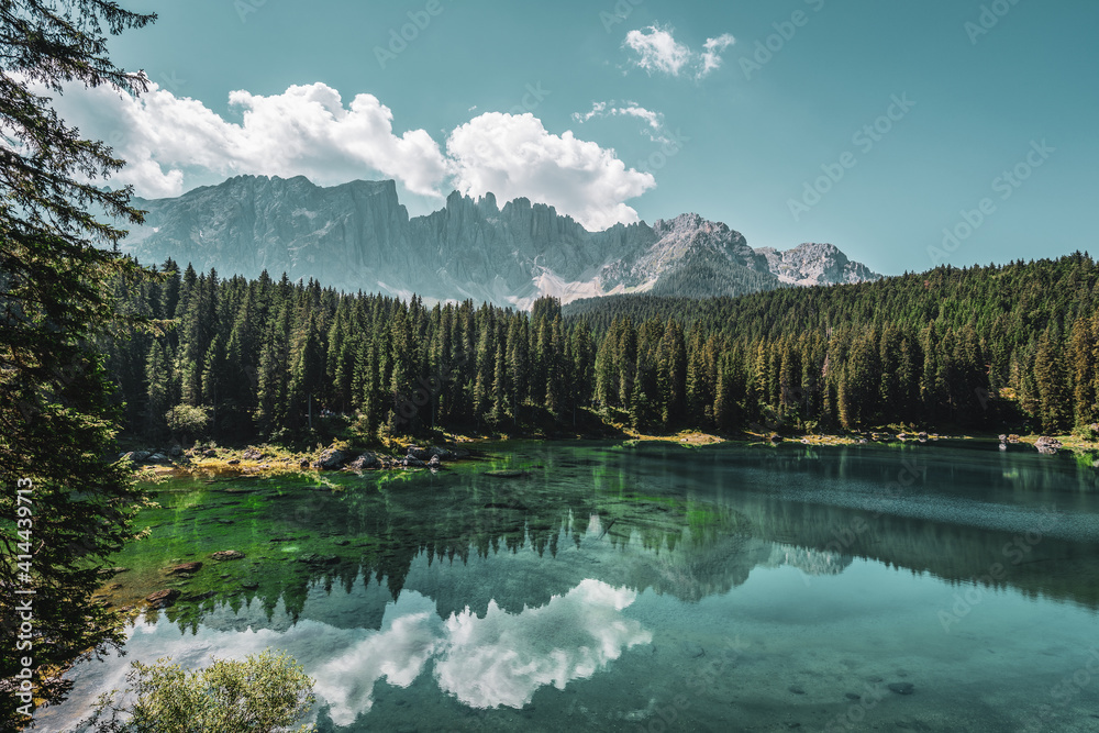 Lake Carezza, view on the lake with the Latemar range in the background. Italy.