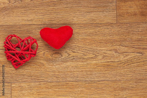 red paper hearts on wooden background