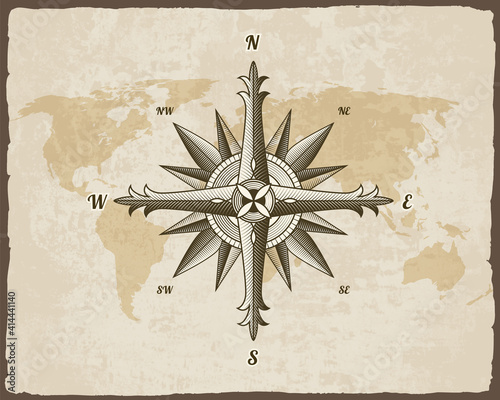 Canvas Print Nautical antique compass sign on old paper texture world map with torn border frame