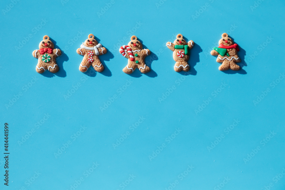 Gingerbread on a blue background. Concept for christmas, new year 2022, winter. Have place for text