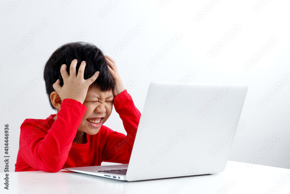 Portrait of little Asian boy tired of distant learning, boy stressed from the online class, mental issues of remote education. Portrait of little Asian boy tired of distant learning, boy stressed from the online class, mental issues of remote education.