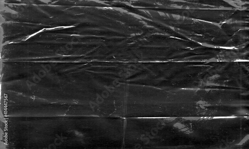 Background texture of a polyethylene,plastic transparent black plastic film,transparent stretched background