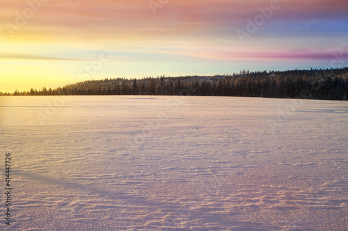 Cross country skiing. A magical start to a new day  in the meadows of the Stolowe Mountains National Park in Poland. A wonderful sunrise in a wild land.