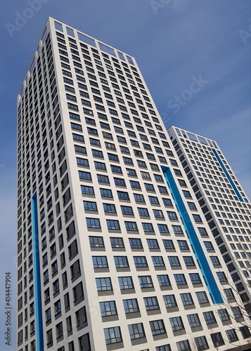 High-rise residential building on a background of blue sky