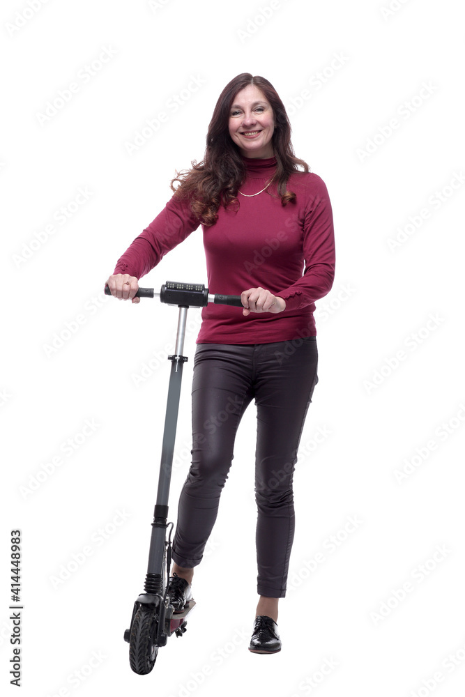 in full growth. a smiling young woman with an electric scooter