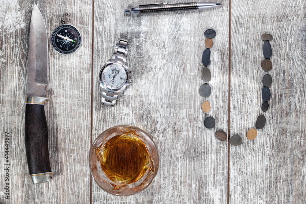 Men's items and accessories : knife, whiskey glass, stylish pen, watch and compass Men's items and accessories : knife, whiskey glass, stylish pen, watch and compass